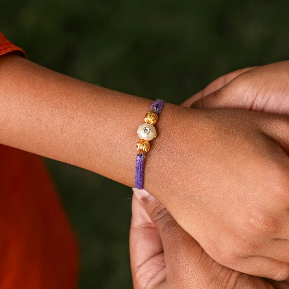 Handmade Pastel Purple Rakhi Thread With Pearl and Gold Beads